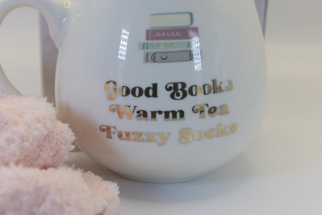 Embrace the ultimate cosy moment with our 'Good Books Warm Tea Fuzzy Socks' Mug &amp; Socks Set. 