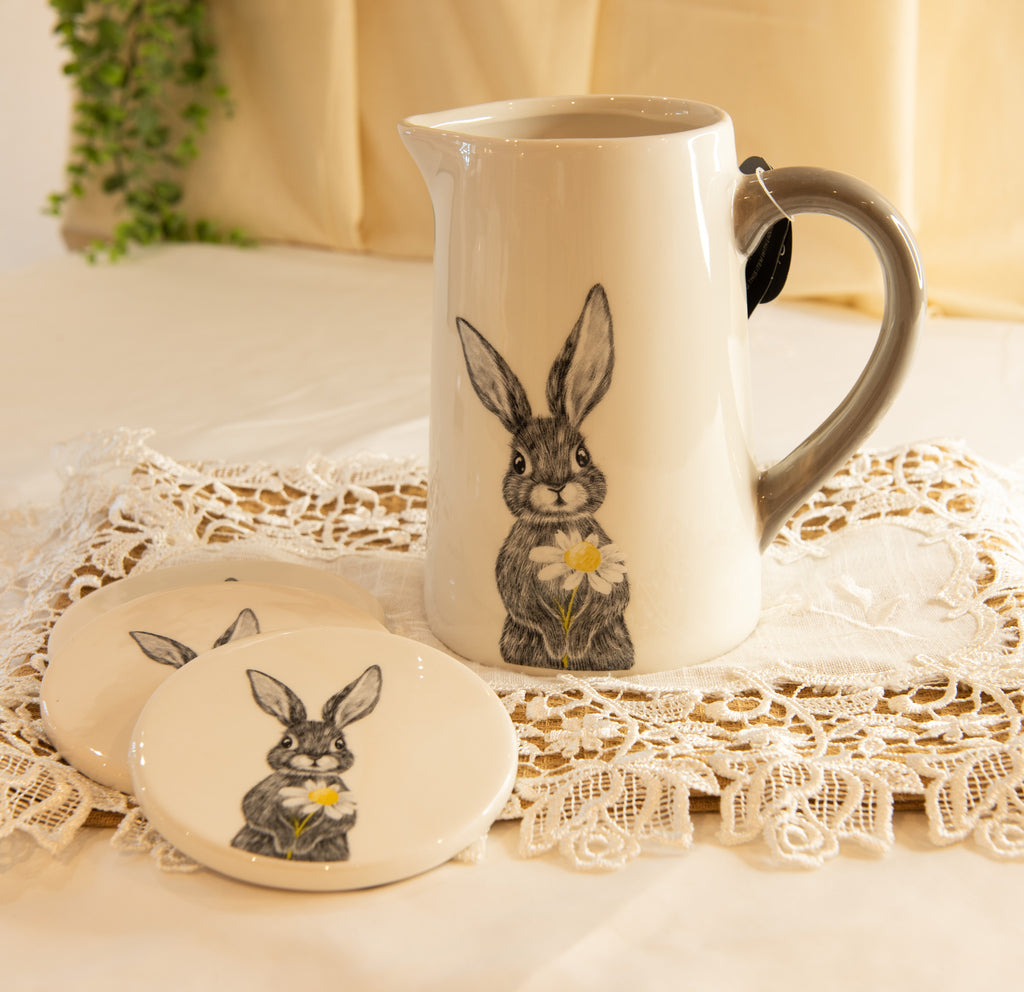 White ceramic jug with grey handle featuring delicate hare holding daisy sketch, spring homeware decoration