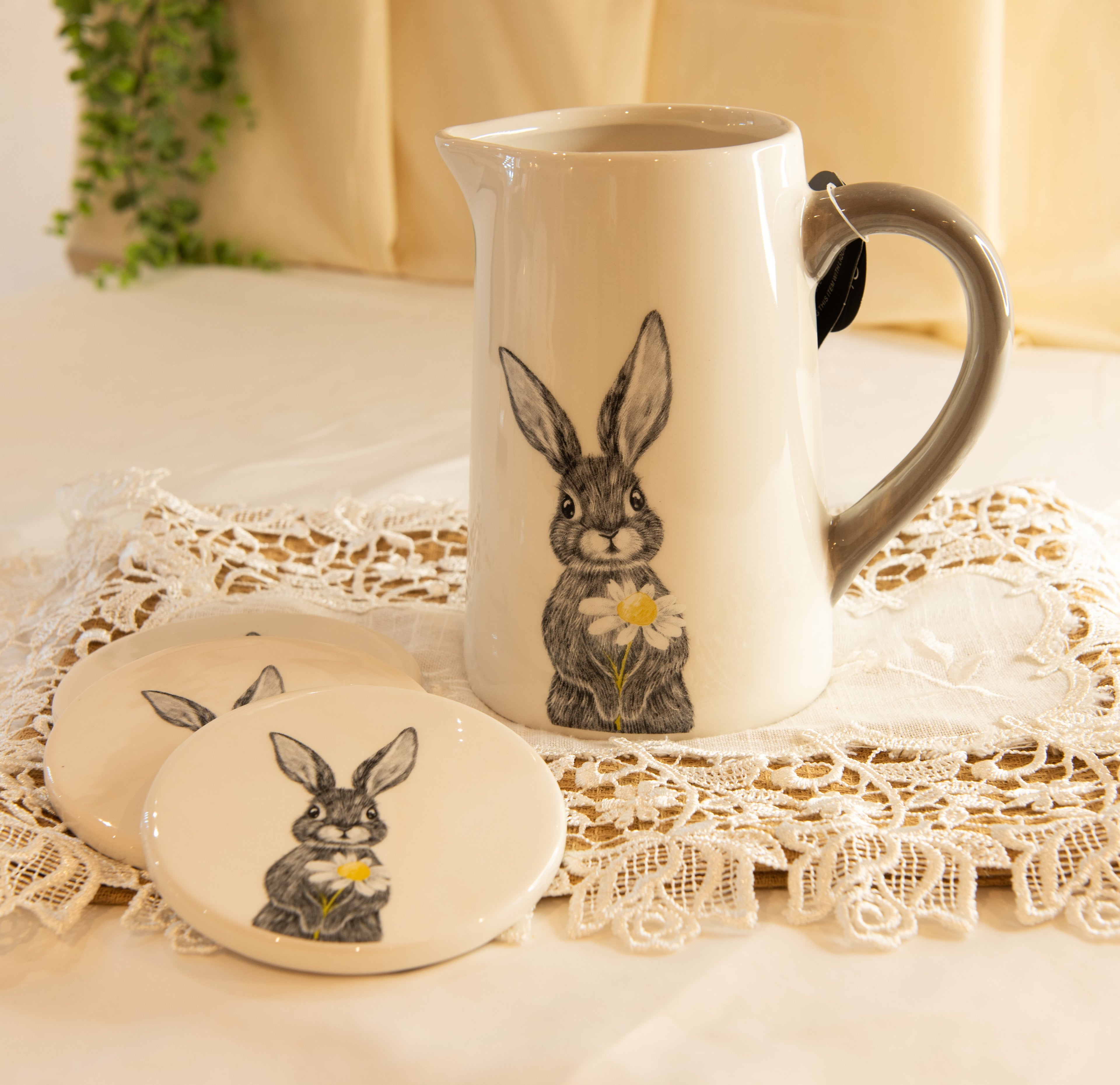 White ceramic jug with grey handle featuring delicate hare holding daisy sketch, spring homeware decoration