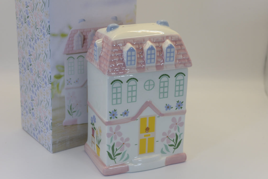 Add a touch of whimsy to your home with our enchanting Pastel House Shaped Ceramic Oil Burner and Wax Warmer. 
