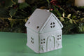Add a touch of charm to your home with our White Gingerbread House Oil Burner. This beautifully detailed ceramic piece works with both fragrance oils and wax melts, filling your space with delightful scents while adding a whimsical, cottage-inspired accent to your decor.